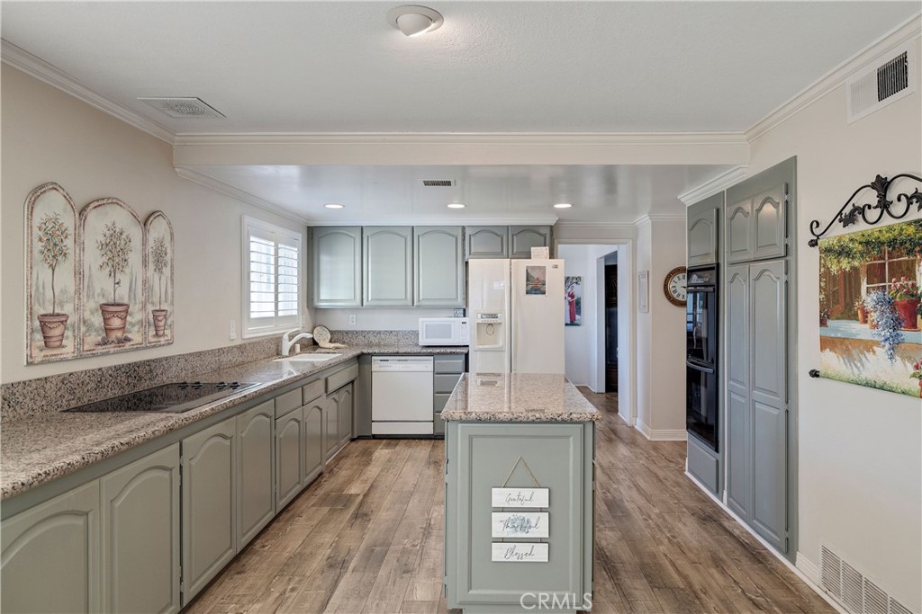 813 Statler Street San Pedro, CA 90731 - Photo 14 of 42 a large kitchen with a lot of counter space and wooden floor