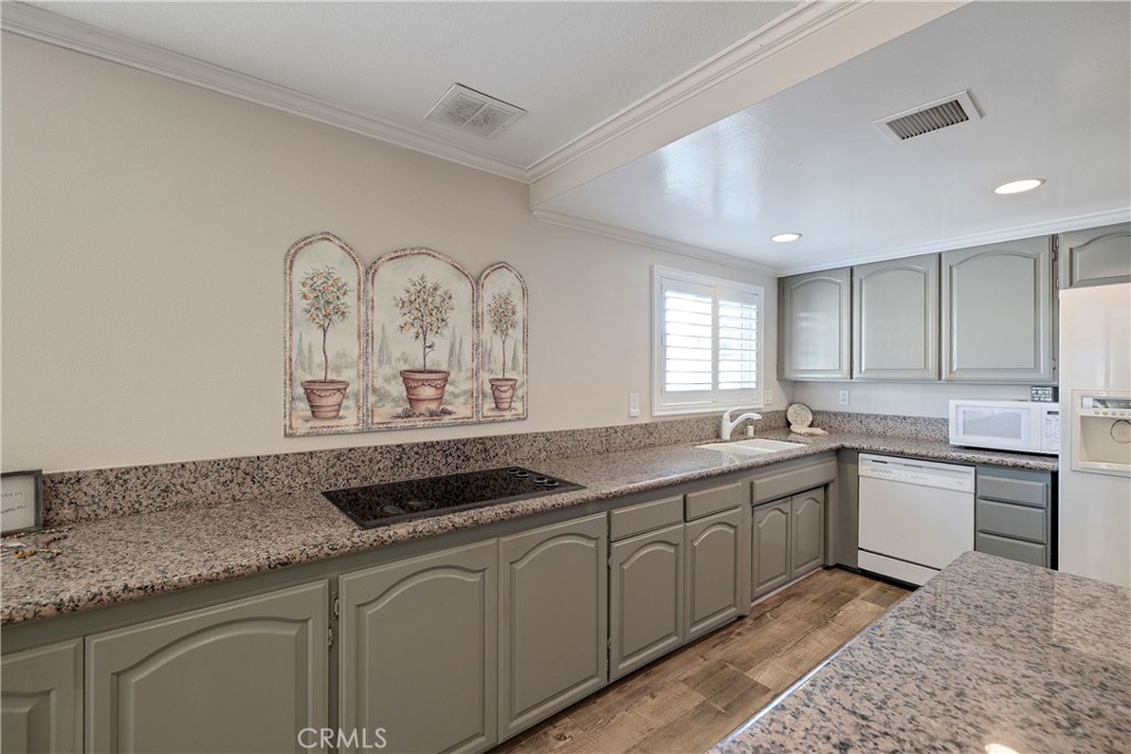 813 Statler Street San Pedro, CA 90731 - Photo 16 of 42 a kitchen with a sink and cabinets