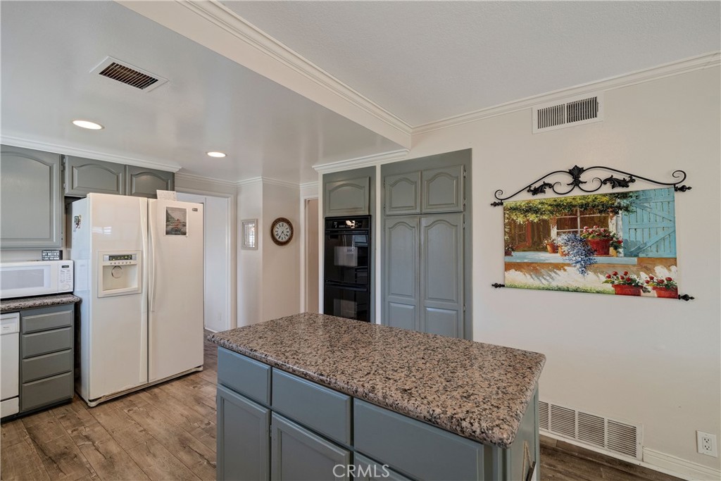 813 Statler Street San Pedro, CA 90731 - Photo 17 of 42 a kitchen with refrigerator and cabinets