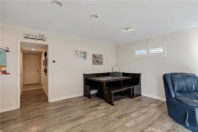 a room with furniture and a wooden floor
