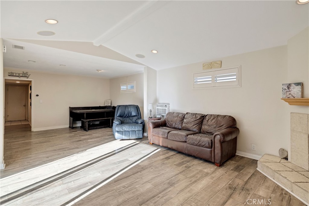 813 Statler Street San Pedro, CA 90731 - Photo 22 of 42 a living room with furniture and a fireplace