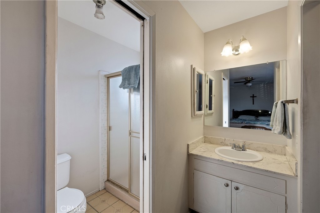 813 Statler Street San Pedro, CA 90731 - Photo 39 of 42 a bathroom with a granite countertop sink toilet and shower