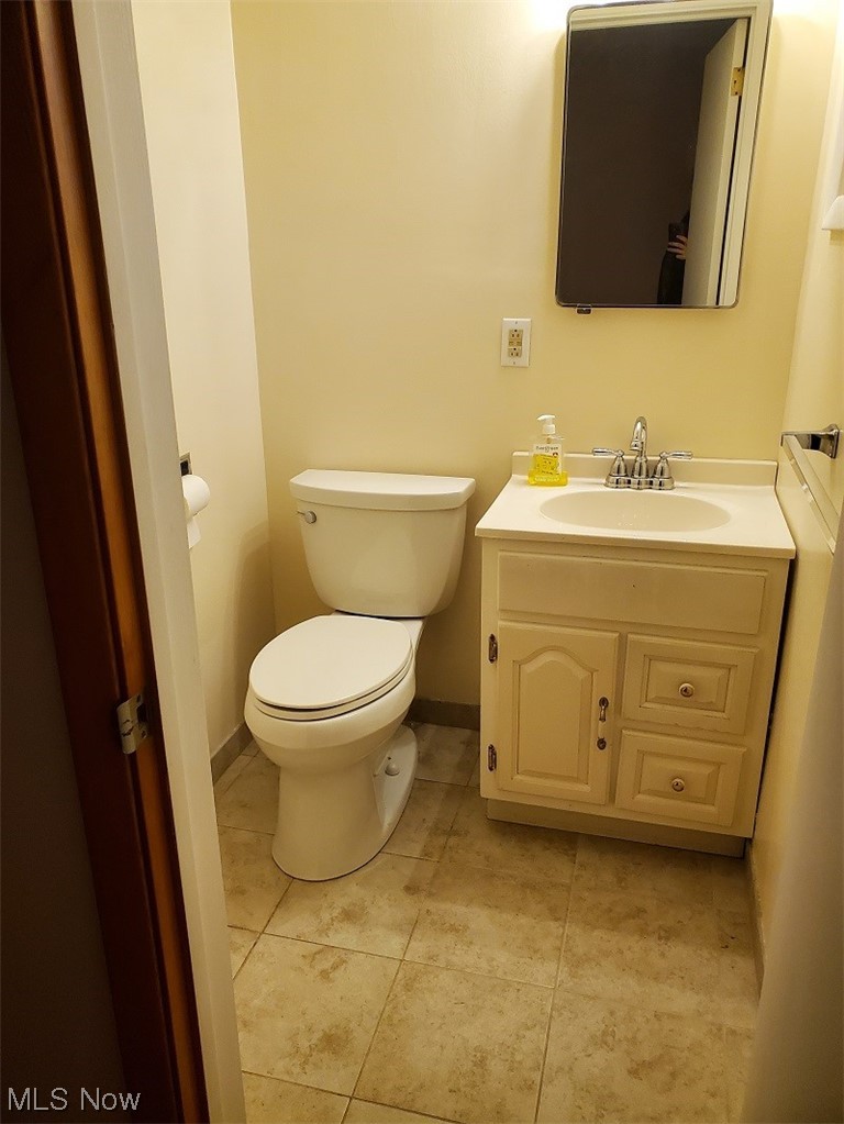 932 Pinecrest Road Girard, OH 44420 - Photo 14 of 25 Bathroom with oversized vanity, toilet, and tile flooring