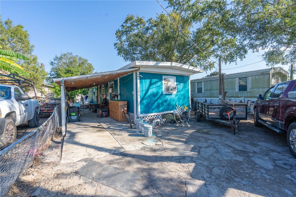 201 Maple Street Winter Haven, FL 33880 - Photo 16 of 16 a view of a chair and table in backyard of a house