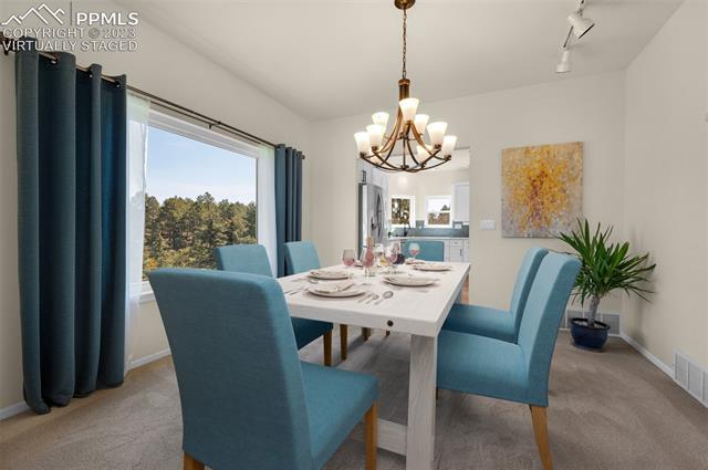 7425 Tobin Road Colorado Springs, CO 80908 - Photo 2 of 9 Virtually staged formal dining with large picture window to bring the outdoors in, and room for large gatherings.