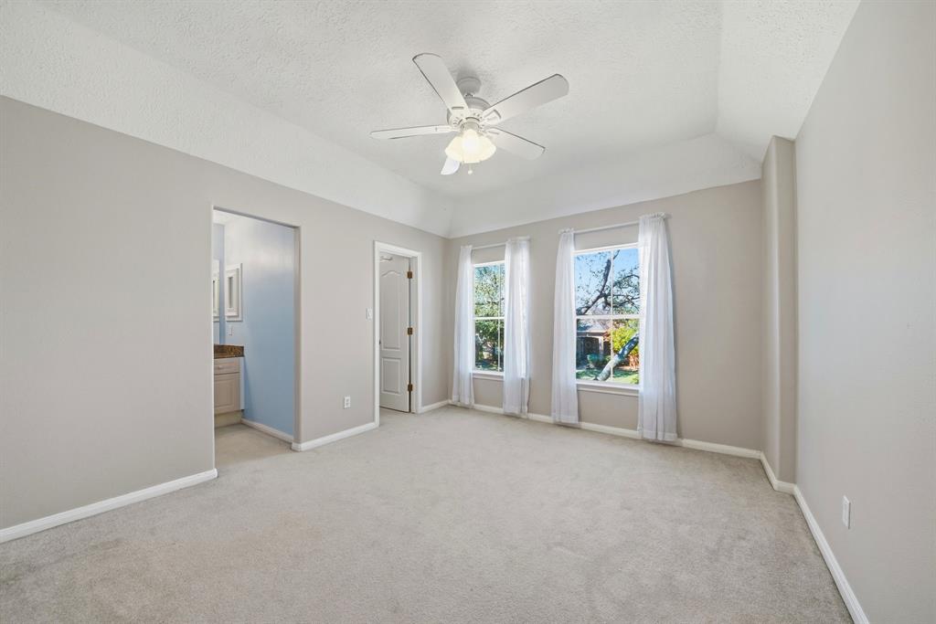 5315 Ridgewood Reef Houston, TX 77041 - Photo 19 of 35 a view of a livingroom with a ceiling fan and window