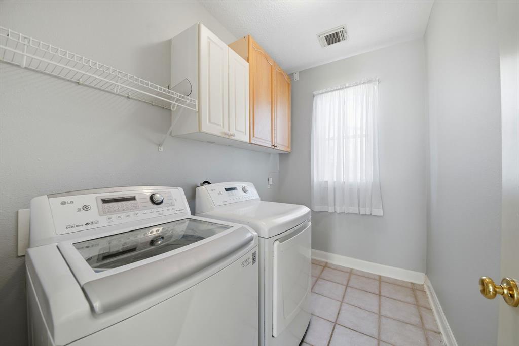 5315 Ridgewood Reef Houston, TX 77041 - Photo 29 of 35 a utility room with dryer and washer