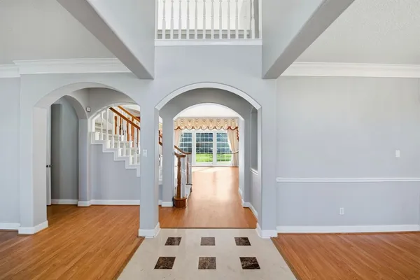 a view of front door with wooden floor