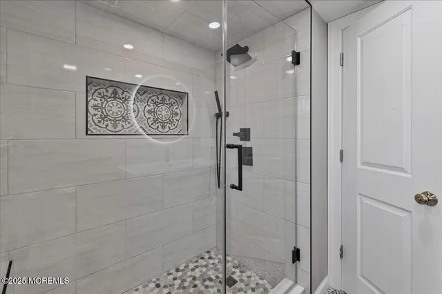 a bathroom with a shower and a shower