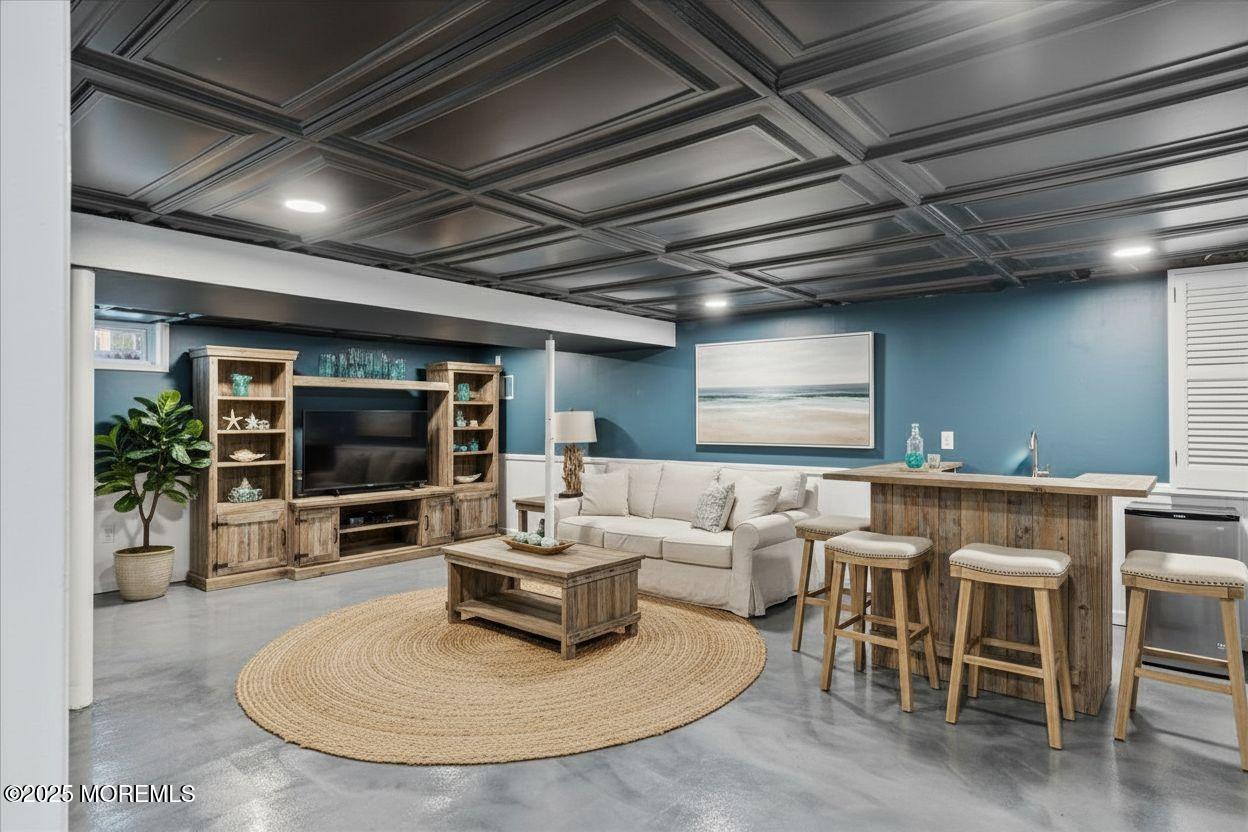 525 Riverwood Avenue Point Pleasant, NJ 08742 - Photo 24 of 30 a living room with furniture and a flat screen tv