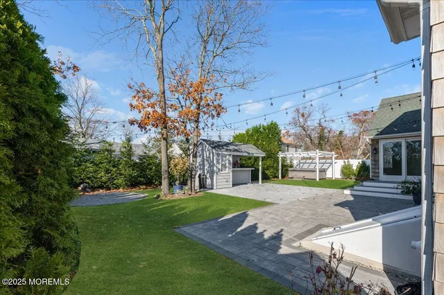 a view of a backyard of the house