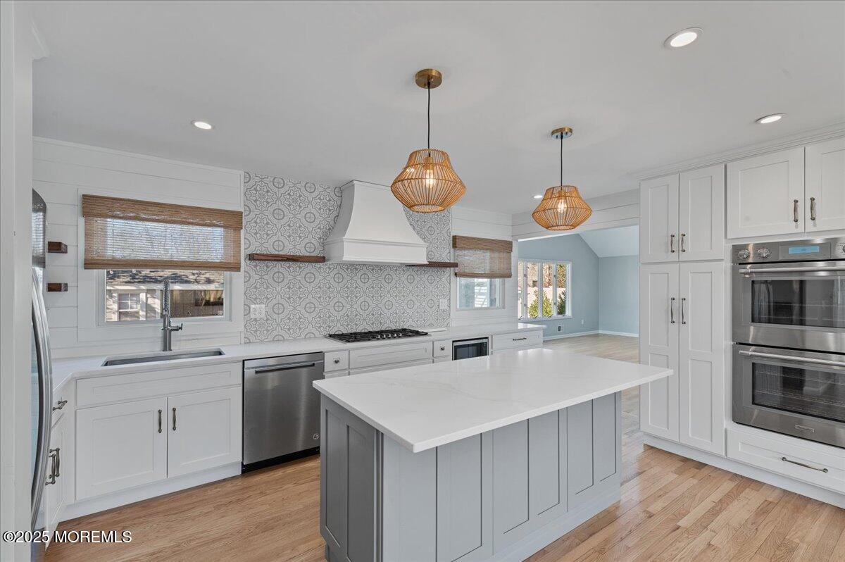 525 Riverwood Avenue Point Pleasant, NJ 08742 - Photo 8 of 30 a kitchen that has a lot of cabinets and appliances