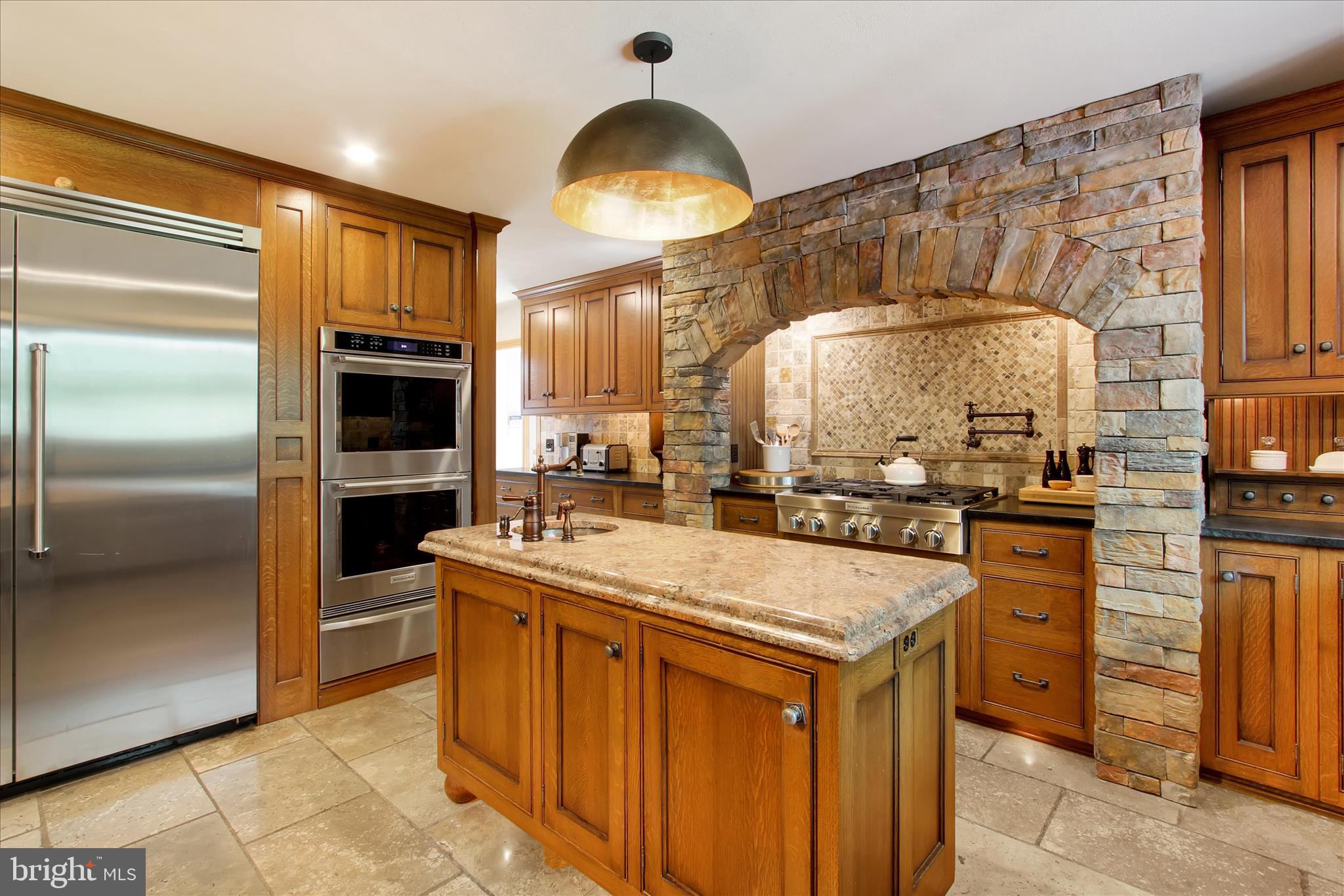 1855 Westwood Road York, PA 17403 - Photo 15 of 60 a kitchen with stainless steel appliances granite countertop a stove and a sink