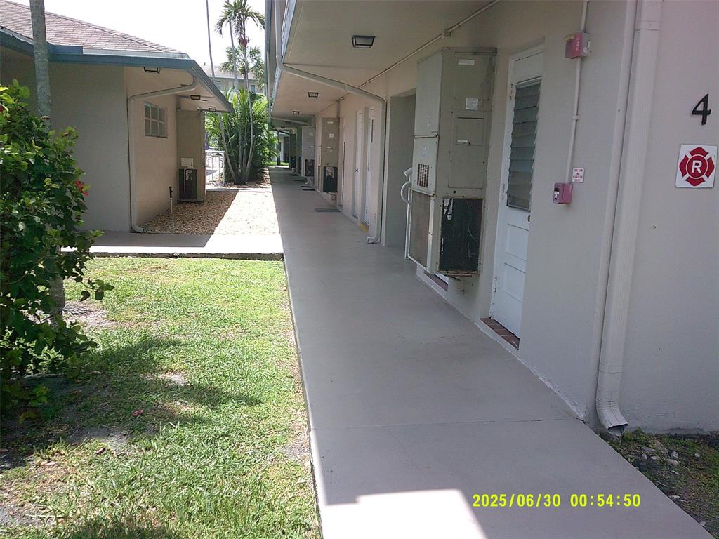 5800 Margate Boulevard, Unit 411 Pompano Beach, FL 33063 - Photo 25 of 30 a view of a house with a porch