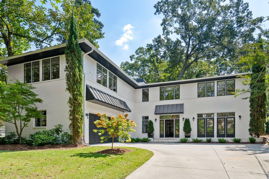 345 East Wesley Road Northeast Atlanta, GA 30305 - Photo 1 of 1 front view of house with a yard