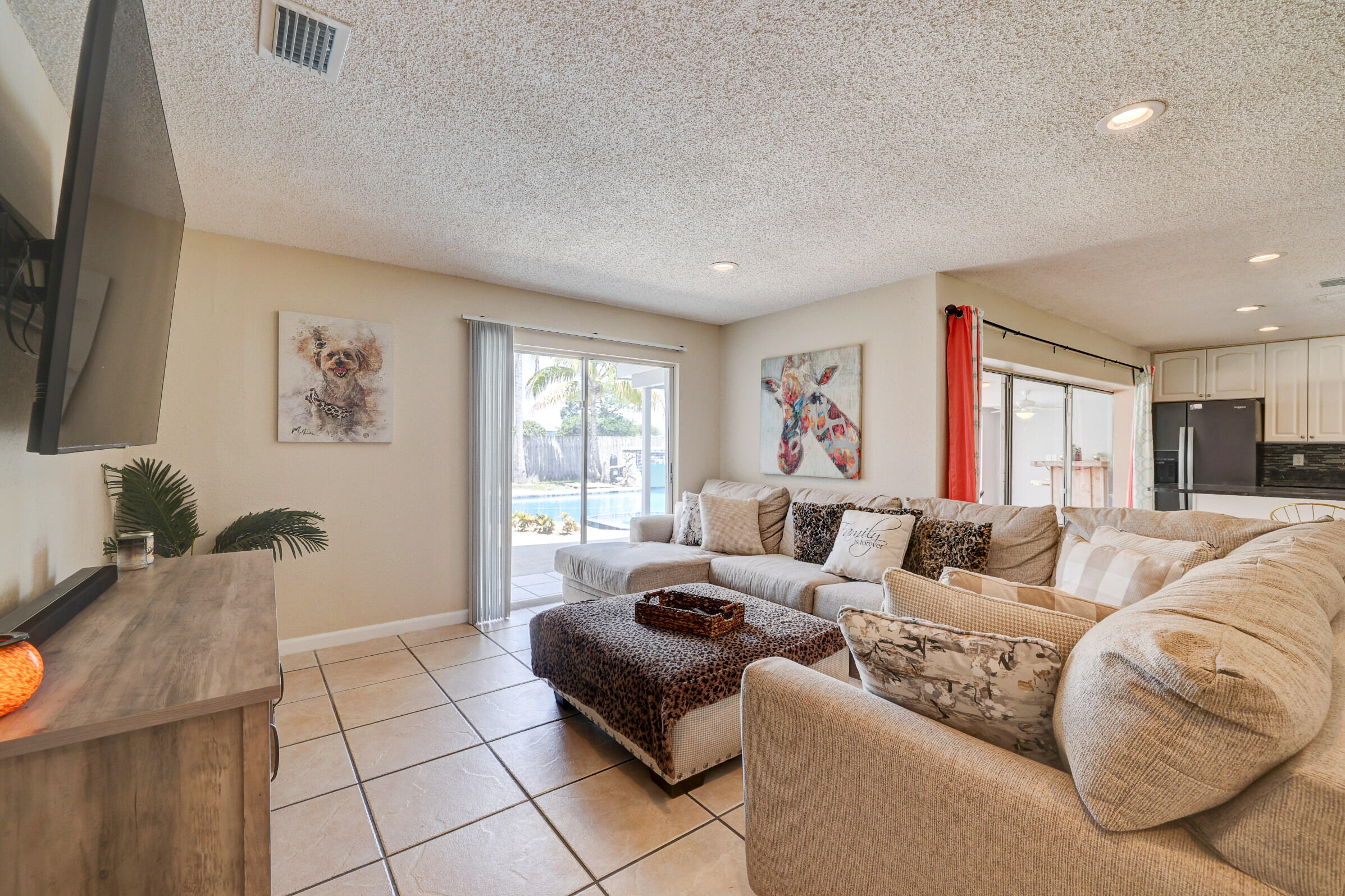2068 Southeast Triumph Road Port St. Lucie, FL 34952 - Photo 11 of 59 a living room with furniture and a flat screen tv