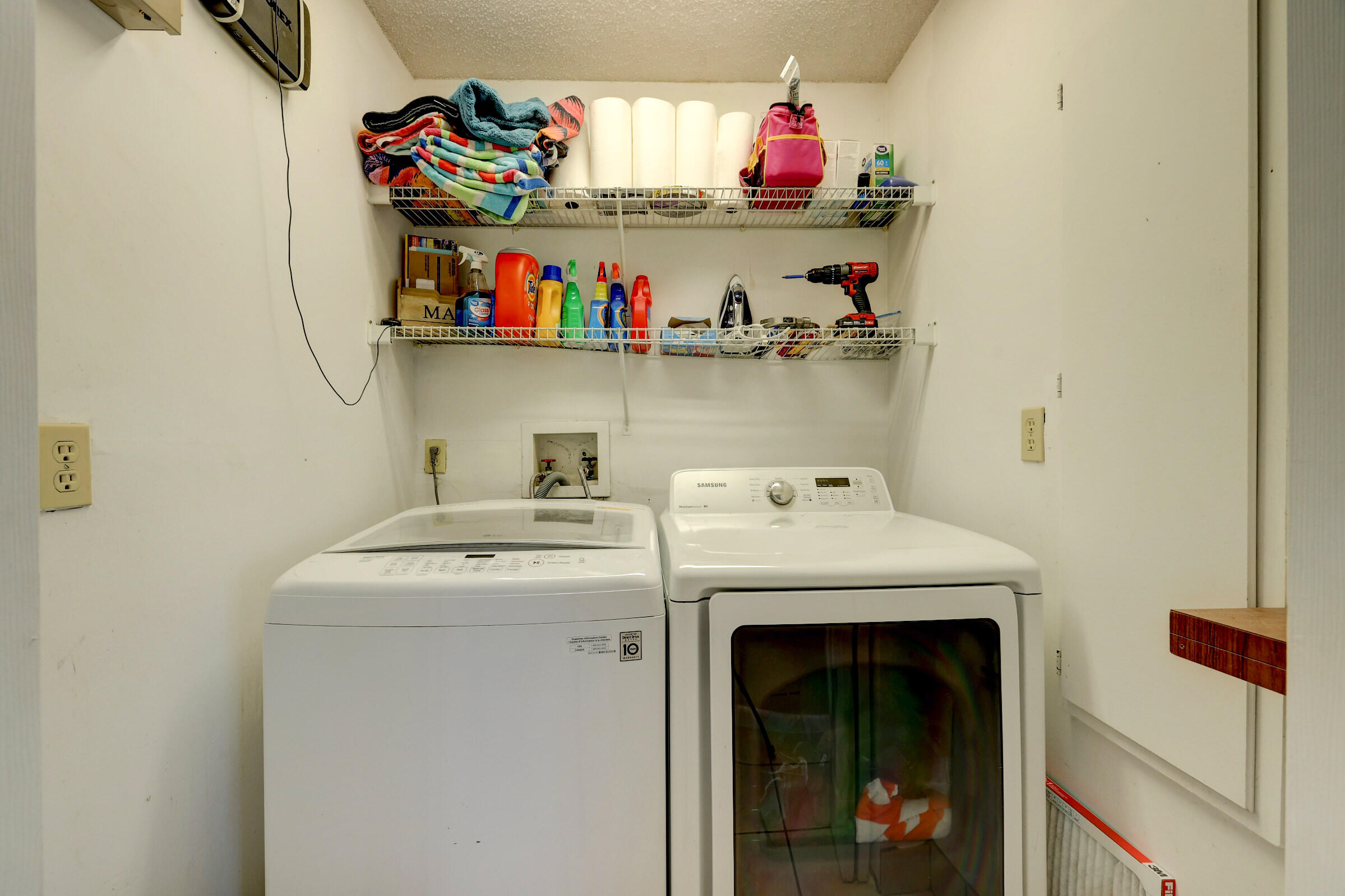 2068 Southeast Triumph Road Port St. Lucie, FL 34952 - Photo 30 of 59 a utility room with dryer and washer