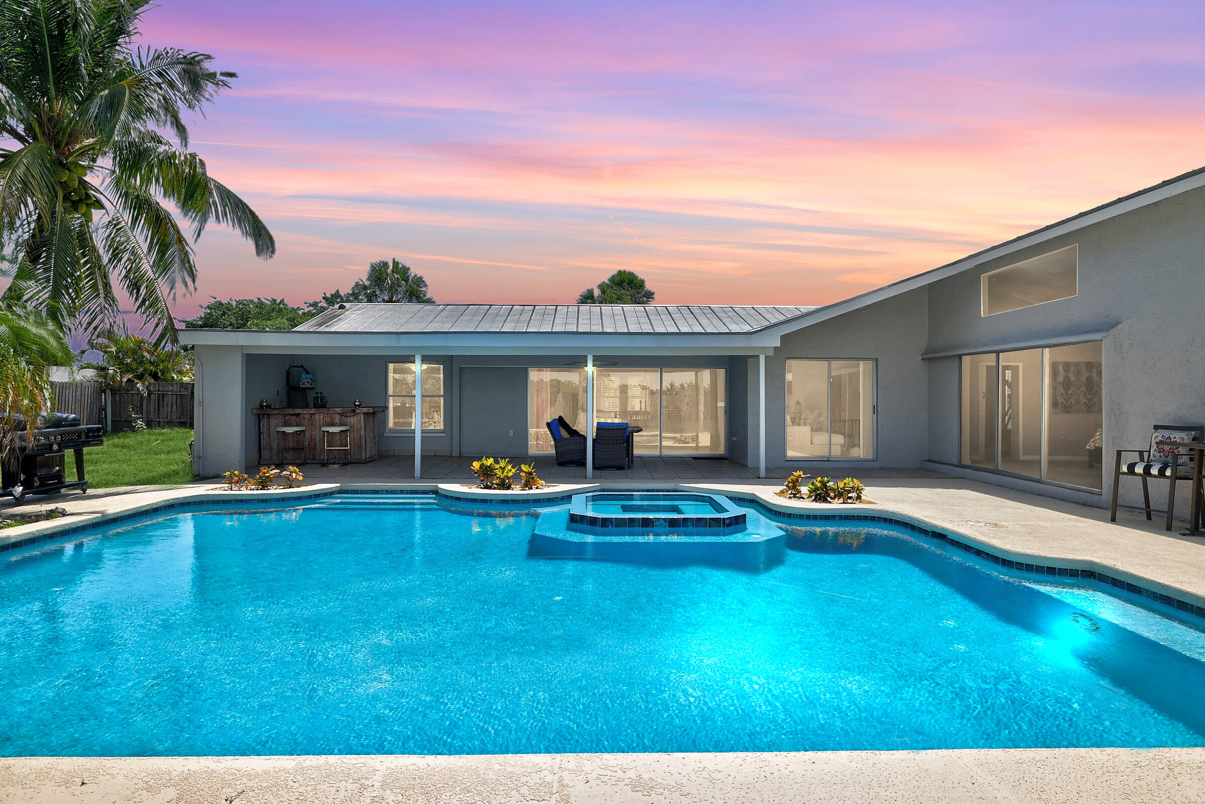 2068 Southeast Triumph Road Port St. Lucie, FL 34952 - Photo 3 of 59 a view of a house with swimming pool and sitting area