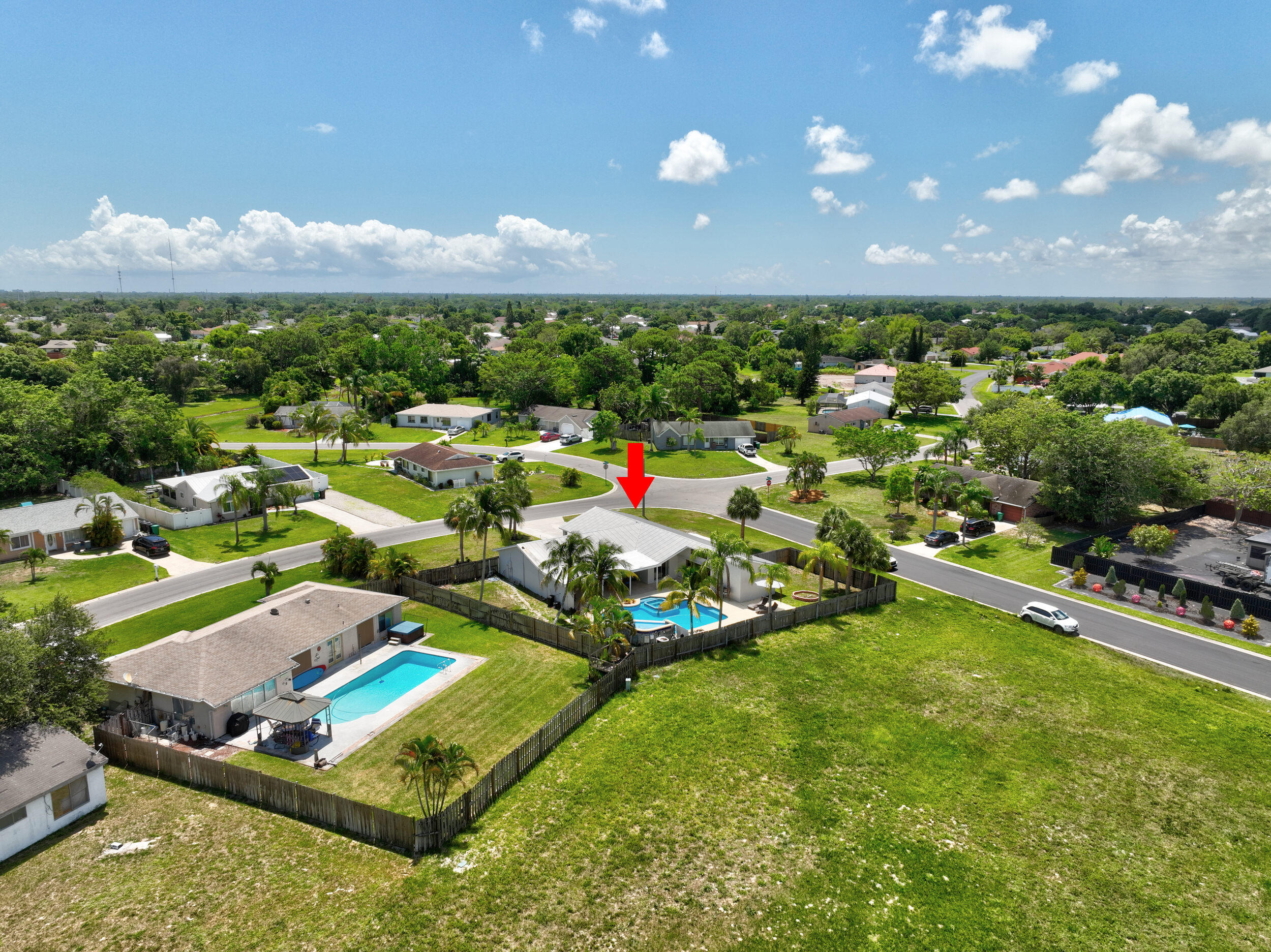 2068 Southeast Triumph Road Port St. Lucie, FL 34952 - Photo 52 of 59 an aerial view of residential houses with outdoor space and a lake view