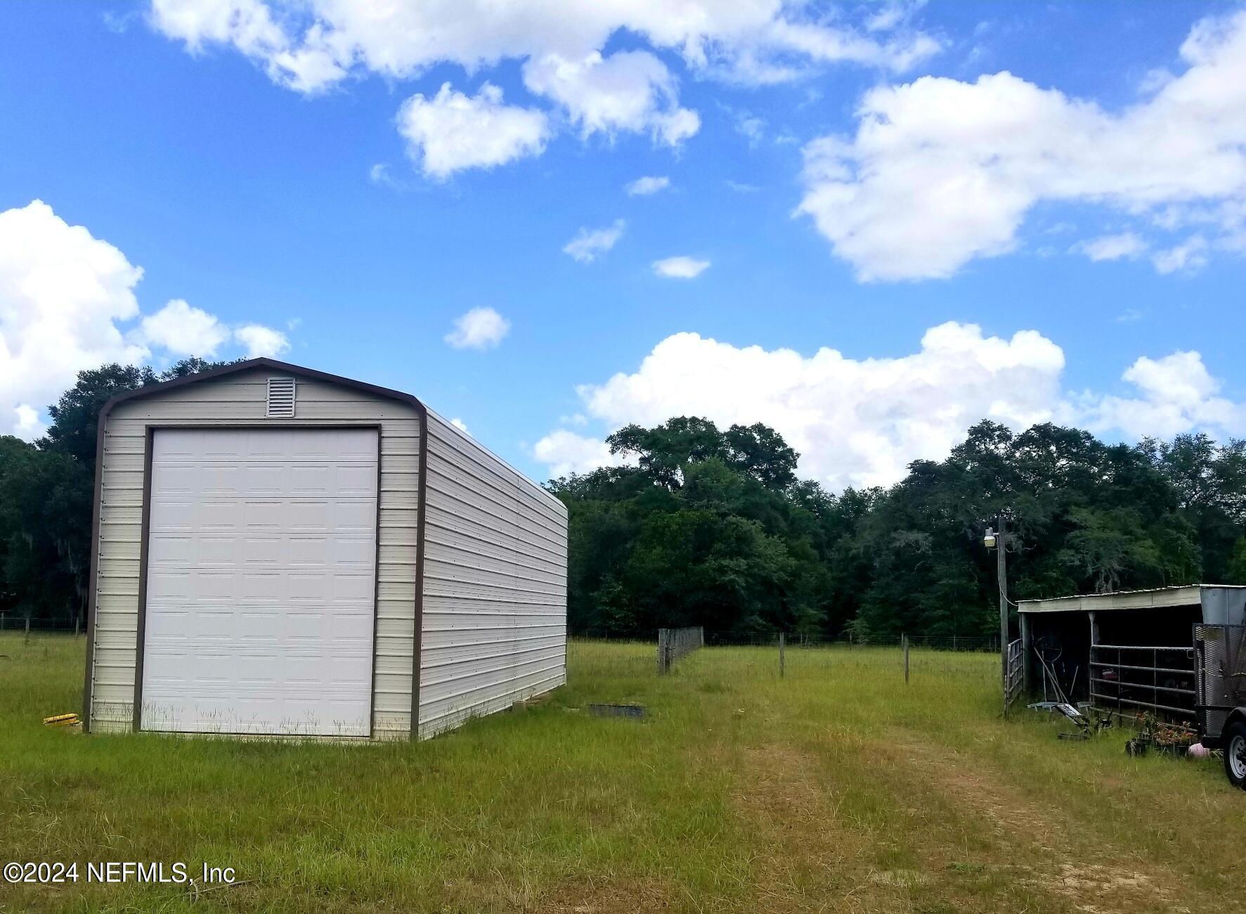 446 Georgetown Shortcut Road Georgetown, FL 32139 - Photo 6 of 8 a backyard of a house with lots of green space