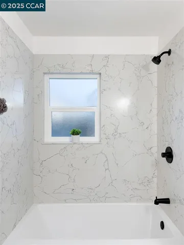 a bathroom with a sink a toilet and a bathtub