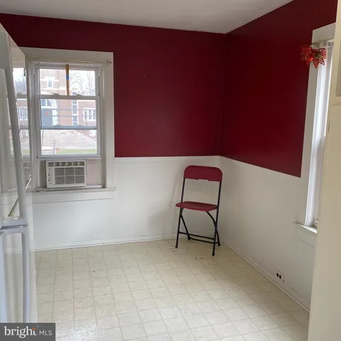 a view of a livingroom with furniture and a window