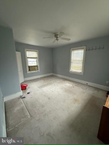 328 328-apt B Broadway Street South, Unit B Pitman, NJ 08071 - Photo 13 of 20 an empty room with windows and ceiling fan