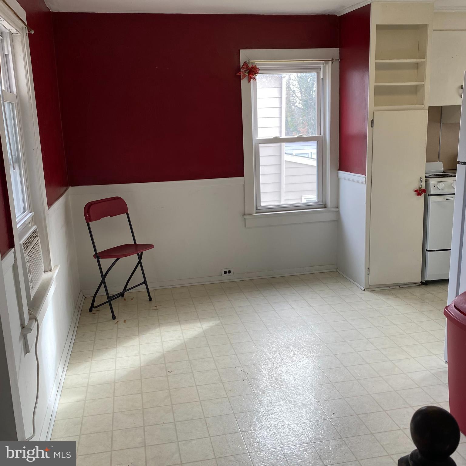 328 328-apt B Broadway Street South, Unit B Pitman, NJ 08071 - Photo 10 of 20 a view of a workspace with furniture and a window
