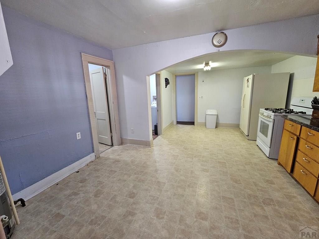 1049 Tipton Street Springfield, CO 81073 - Photo 5 of 20 an empty room with a mirror