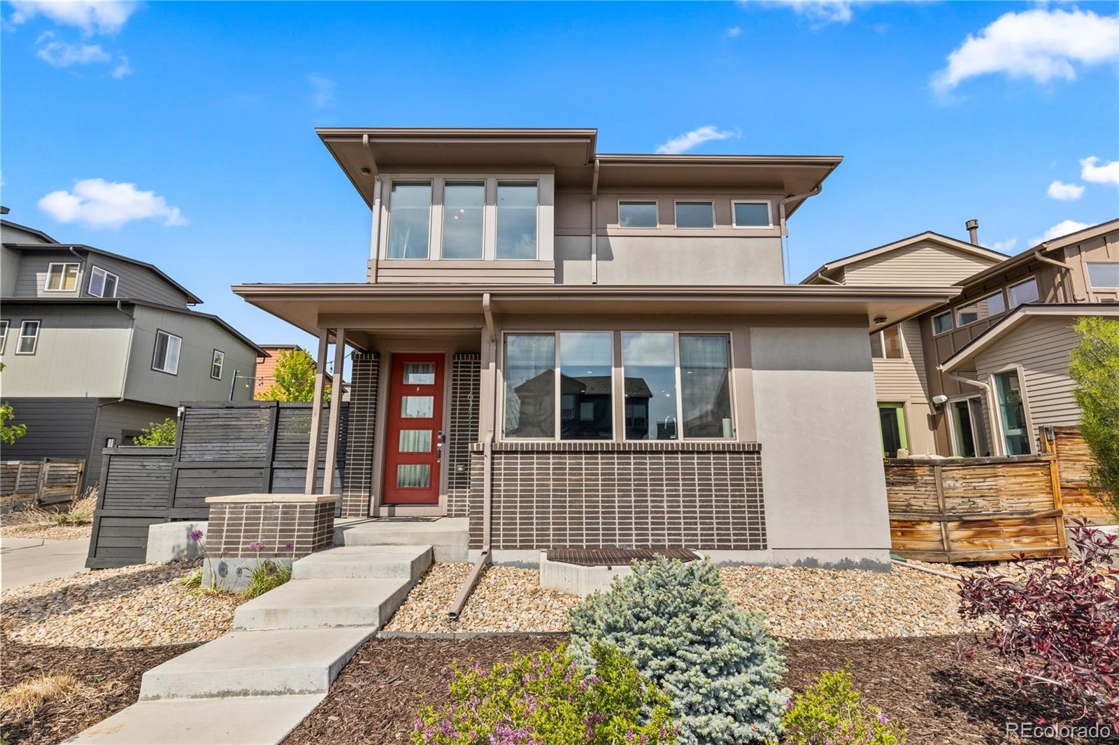 6721 Morrison Drive Denver, CO 80221 - Photo 1 of 40 a front view of a house with a yard