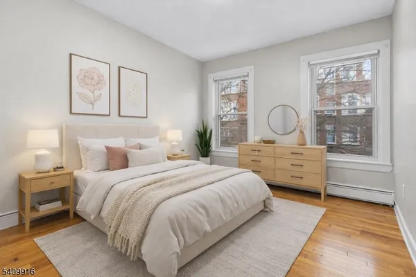 a bedroom with bed and window