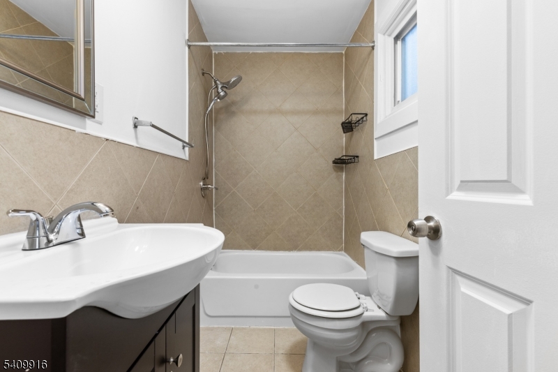 336 Madison Avenue, Unit 2 Newark, NJ 07108 - Photo 10 of 11 a bathroom with a sink toilet and shower