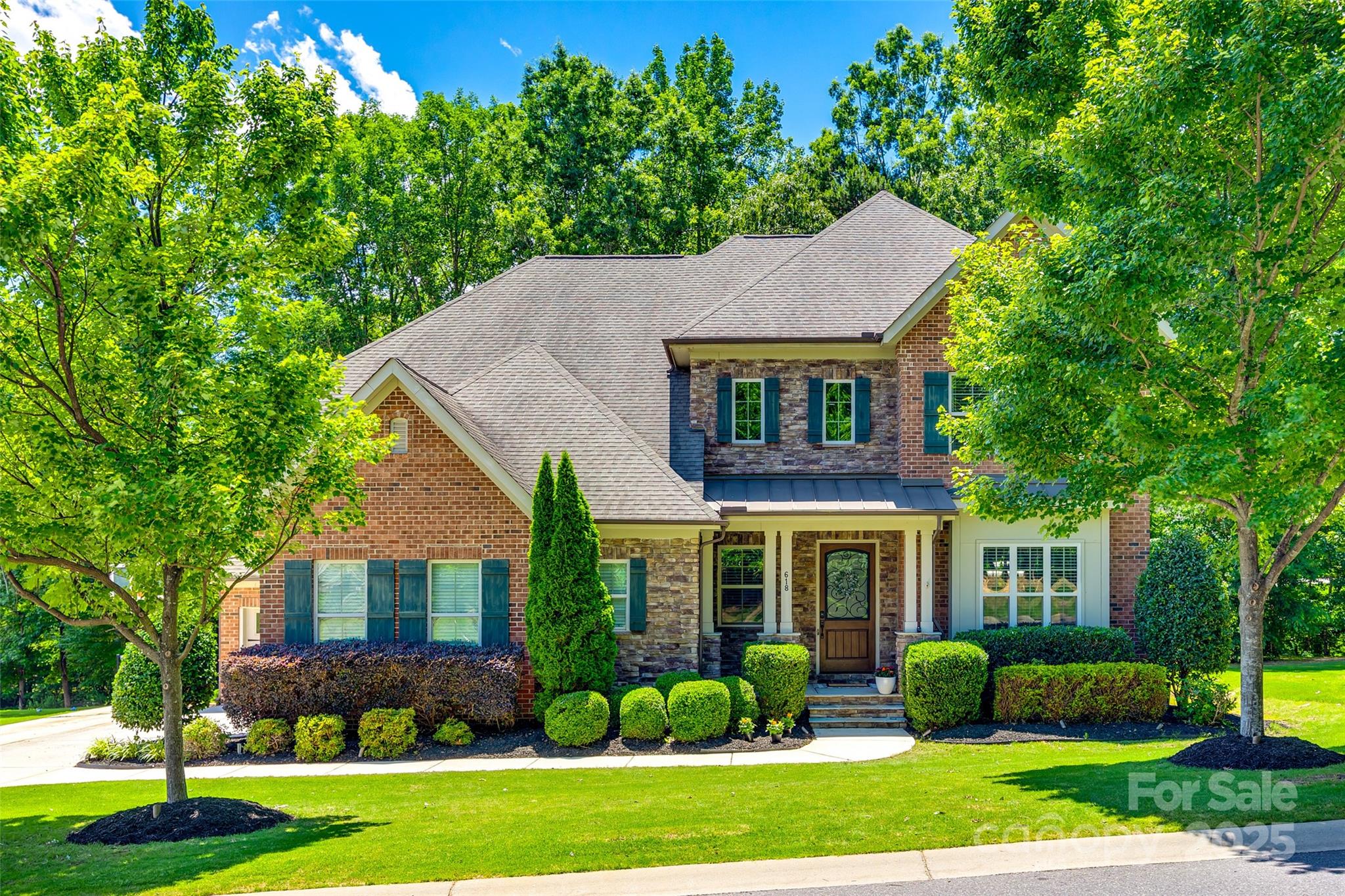 front view of a house with a yard