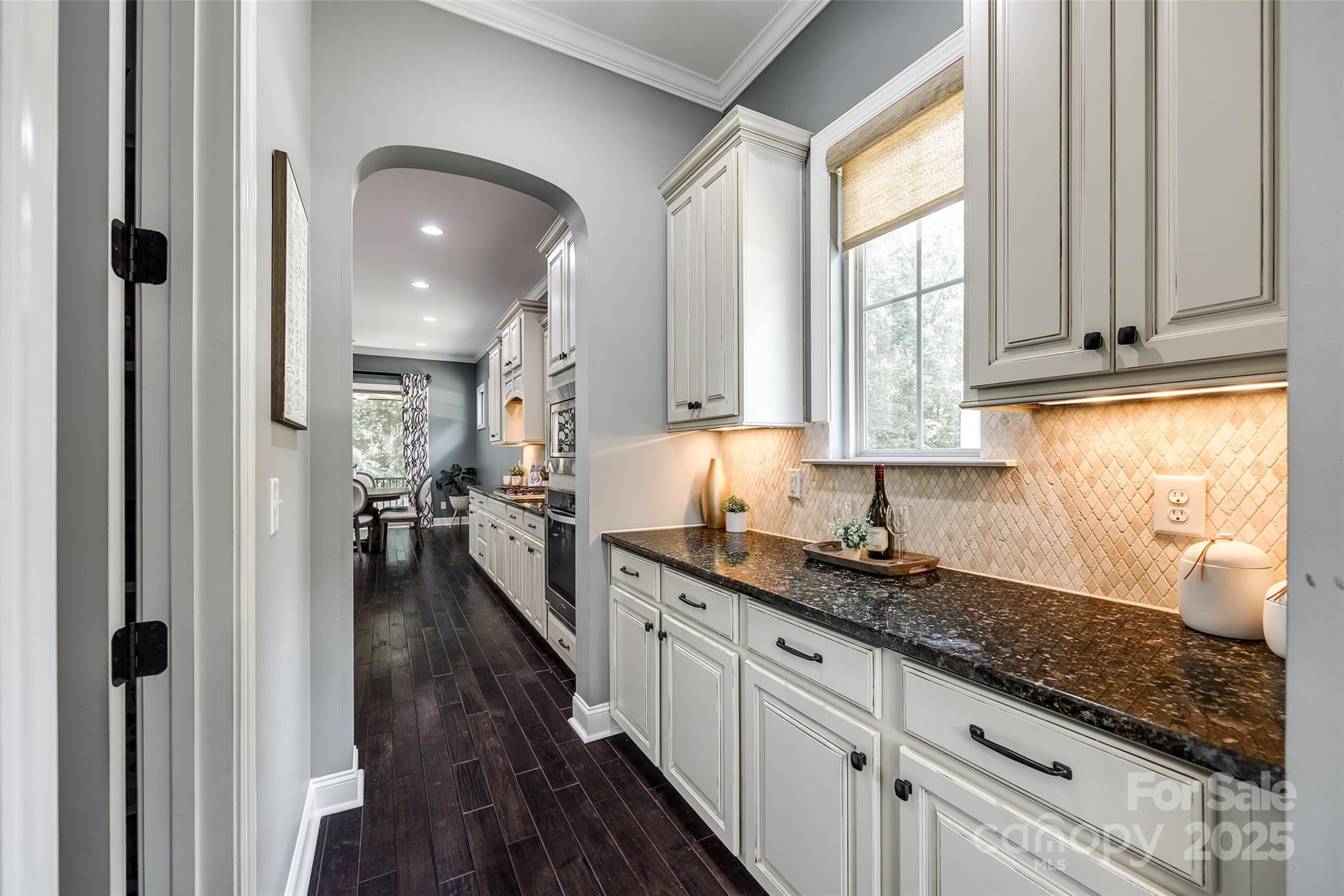 618 Chase Court Fort Mill, SC 29708 - Photo 11 of 48 a kitchen with granite countertop a sink stainless steel appliances refrigerator and cabinets