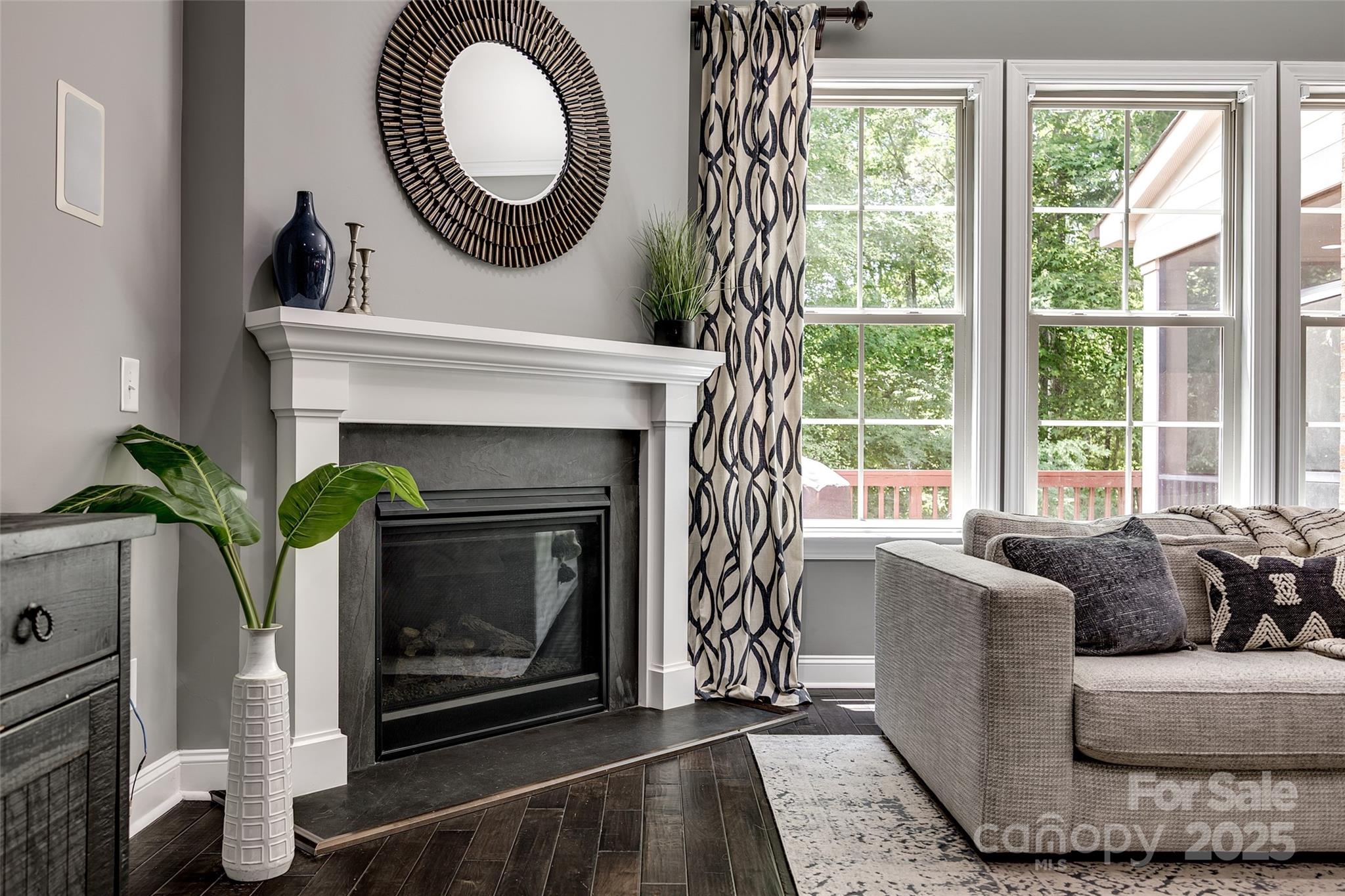 618 Chase Court Fort Mill, SC 29708 - Photo 19 of 48 a living room with furniture a window and a fireplace