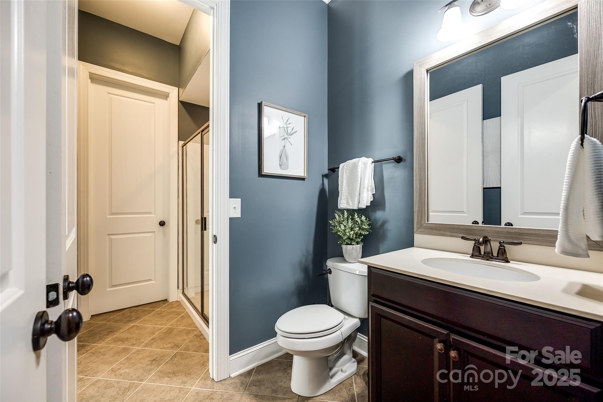 618 Chase Court Fort Mill, SC 29708 - Photo 22 of 48 a bathroom with a sink toilet and shower