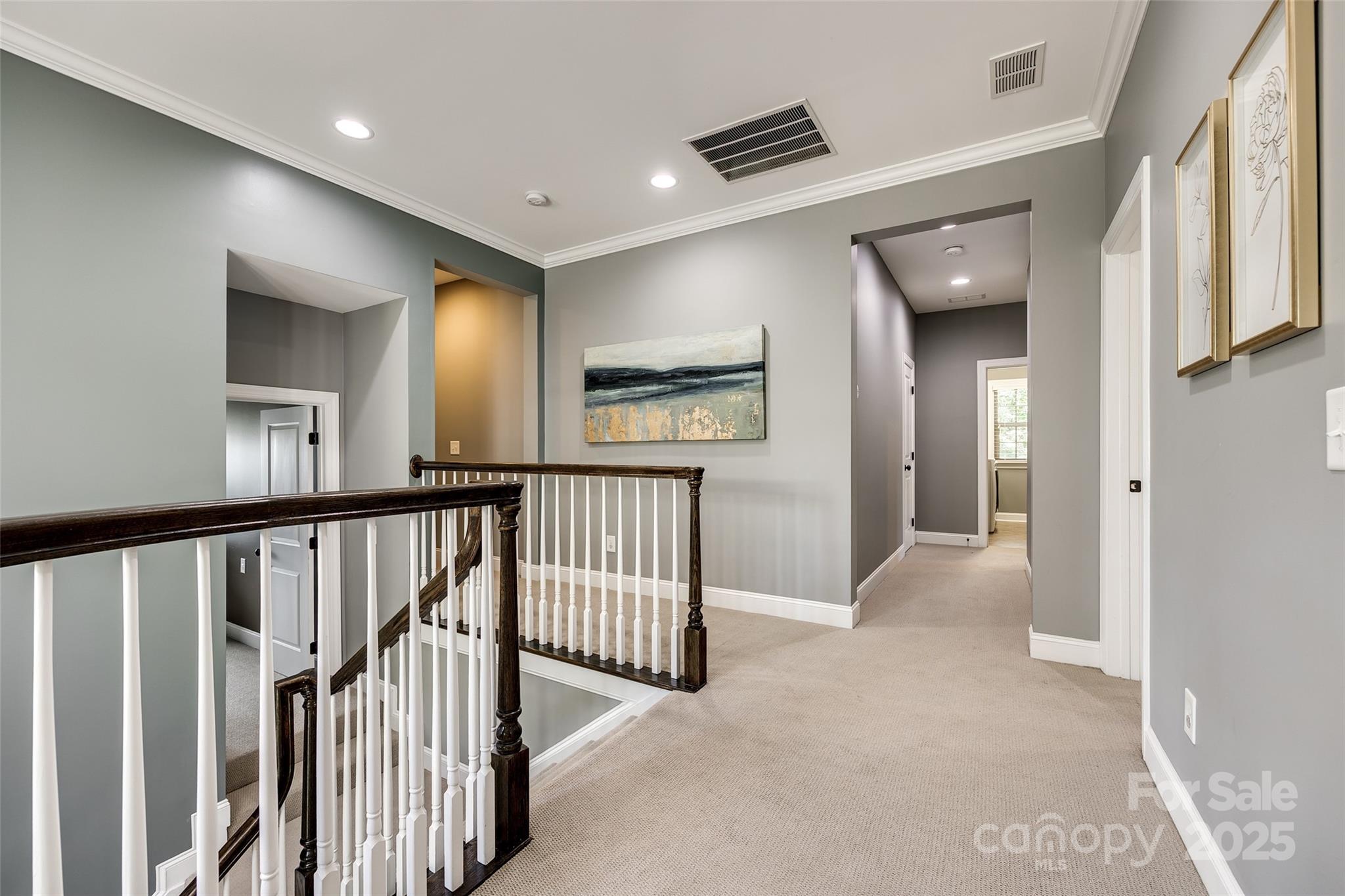 618 Chase Court Fort Mill, SC 29708 - Photo 24 of 48 a view of a hallway with wooden floor and windows