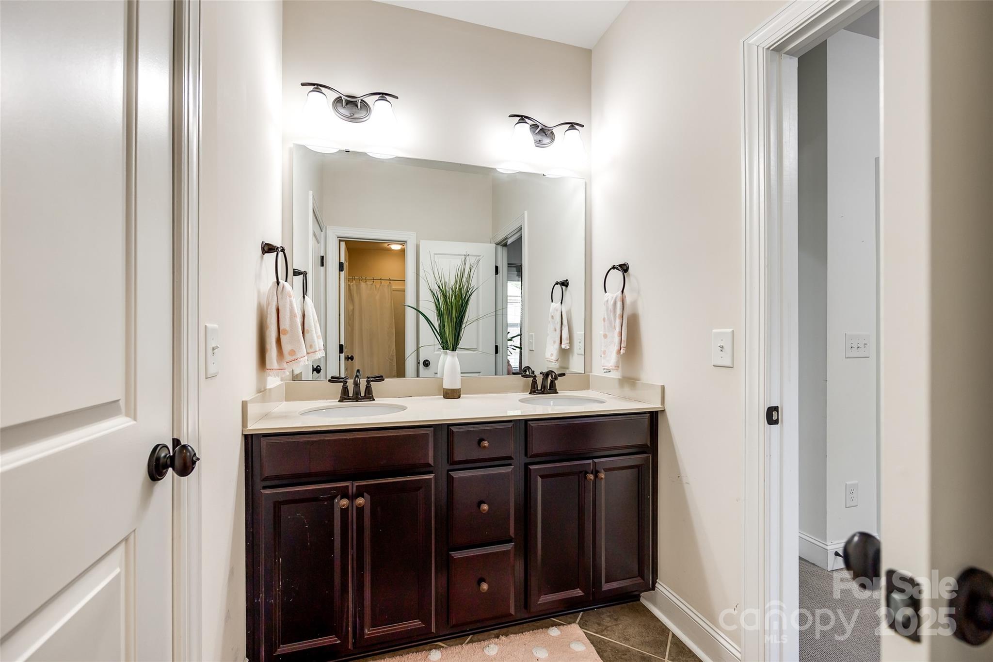 618 Chase Court Fort Mill, SC 29708 - Photo 36 of 48 a bathroom with a double vanity sink and mirror
