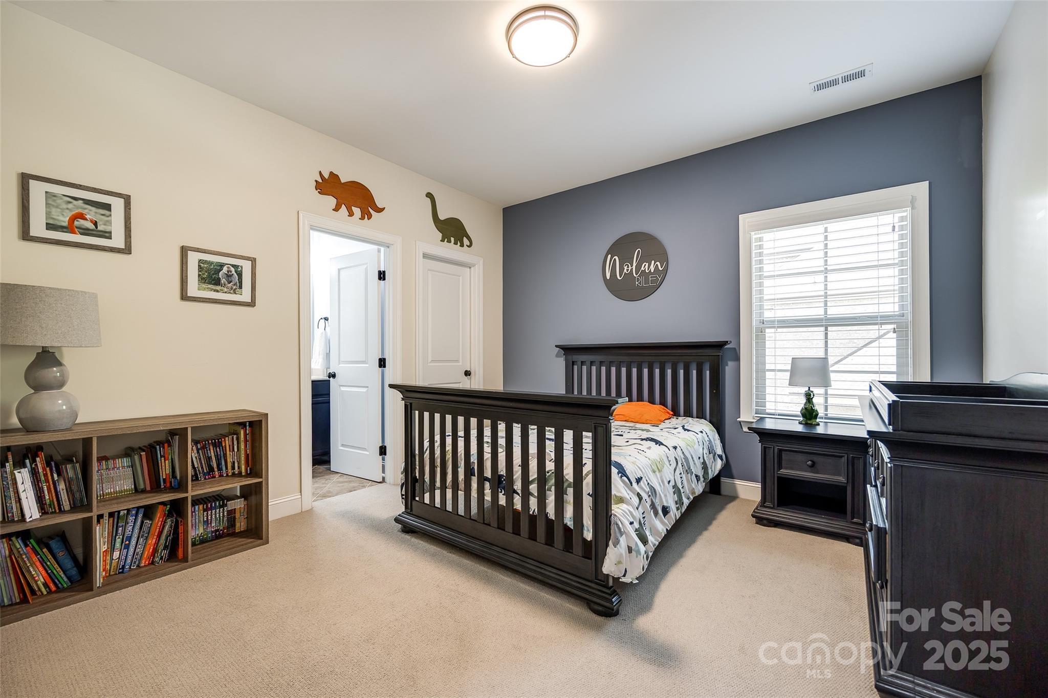 618 Chase Court Fort Mill, SC 29708 - Photo 37 of 48 a bed room with a bed and a book shelf