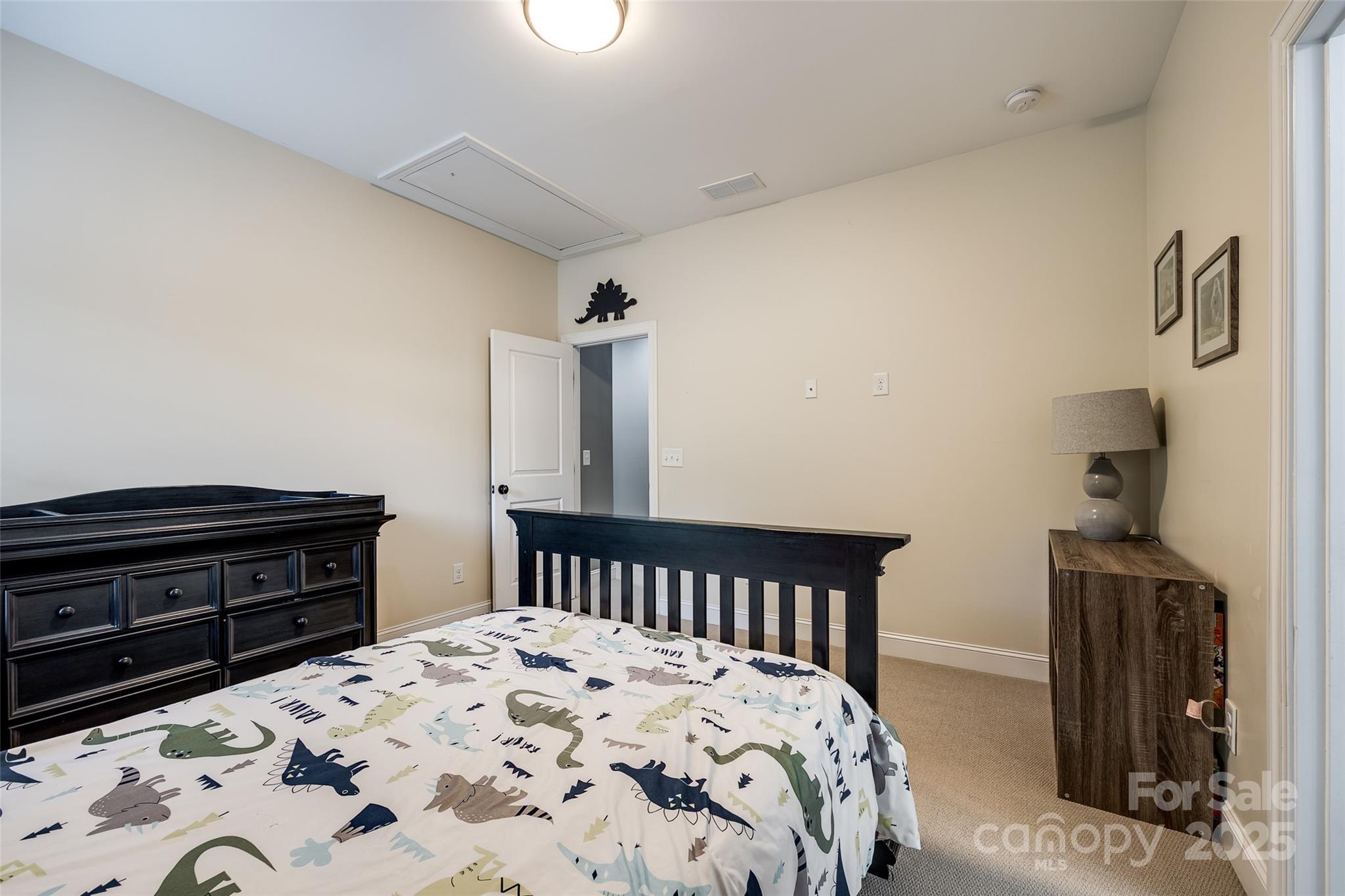 618 Chase Court Fort Mill, SC 29708 - Photo 38 of 48 a bedroom with a bed and a dresser