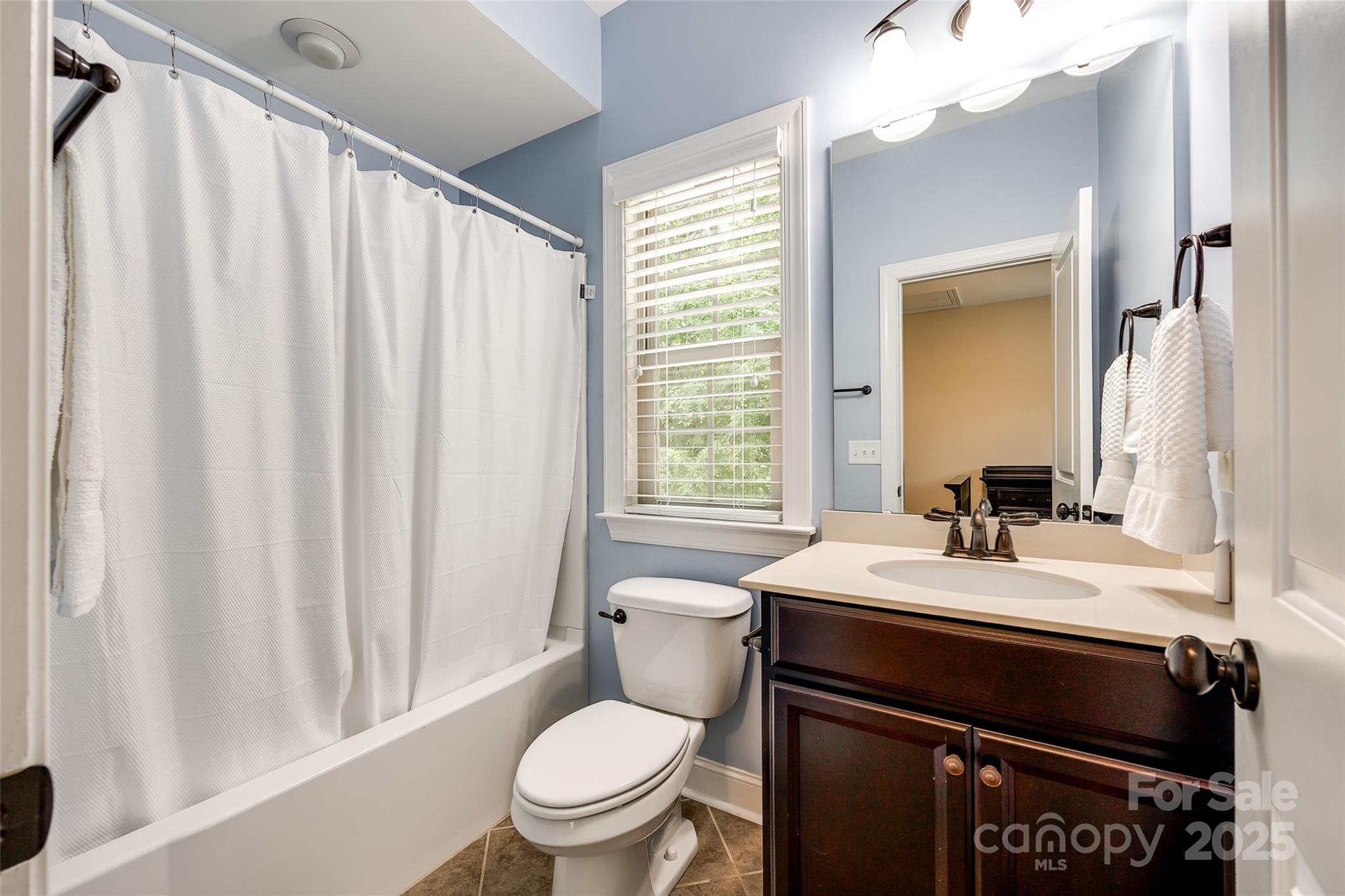 618 Chase Court Fort Mill, SC 29708 - Photo 39 of 48 a bathroom with a sink vanity mirror and toilet