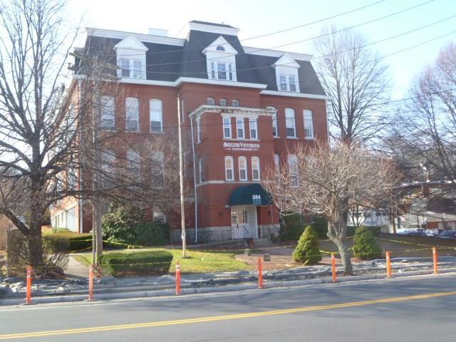 a view of a building with a street