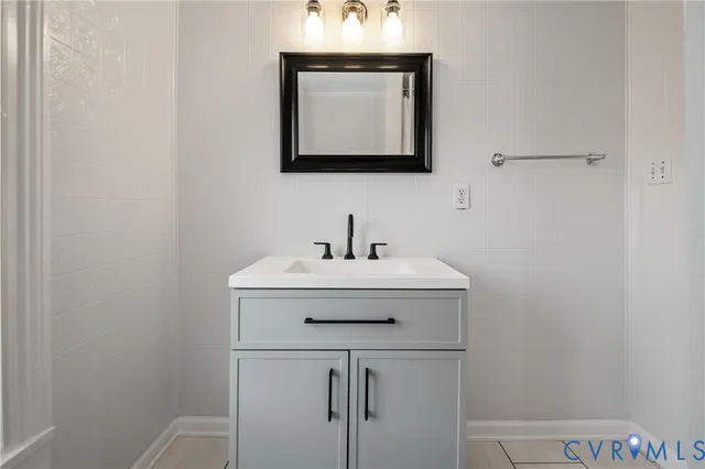 a bathroom with a tub and shower