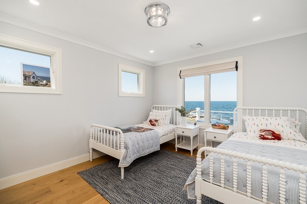 14 Sunset Point Road Gloucester, MA 01930 - Photo 23 of 40 a bedroom with furniture and a window