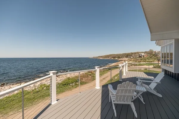 a view of a balcony with table and chairs
