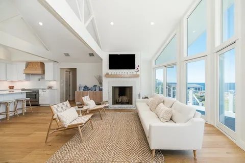 a living room with furniture fireplace and flat screen tv