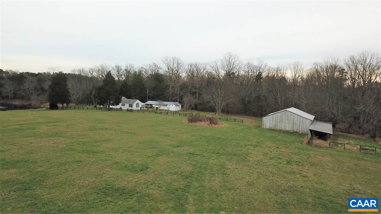 4259 Richmond Road Keswick, VA 22947 - Photo 3 of 32 a view of a garden with a bench in the background