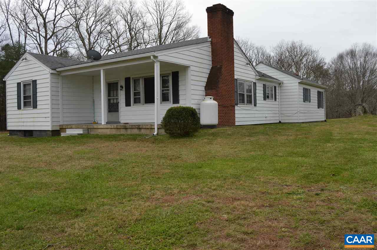 4259 Richmond Road Keswick, VA 22947 - Photo 6 of 32 a front view of a house with a garden and yard