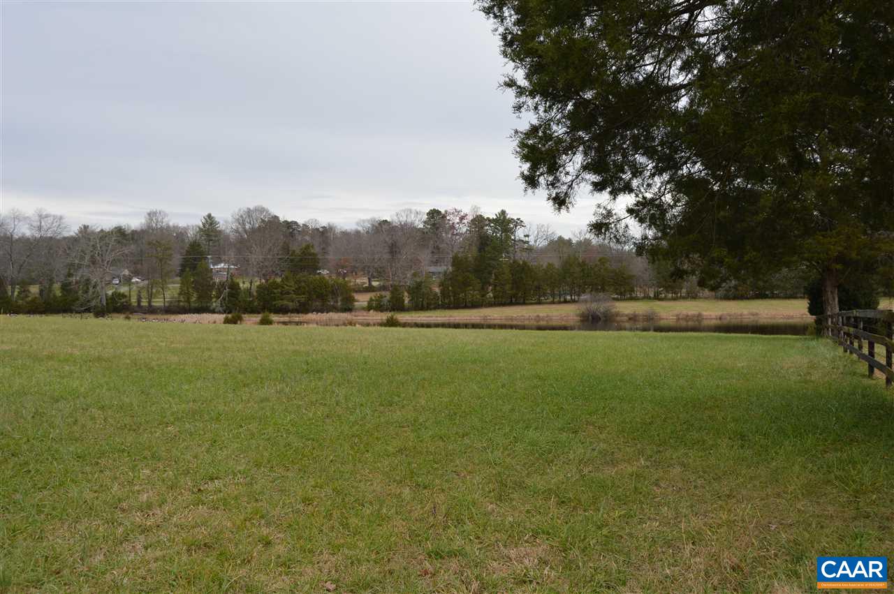 4259 Richmond Road Keswick, VA 22947 - Photo 8 of 32 a view of outdoor space with green field and trees