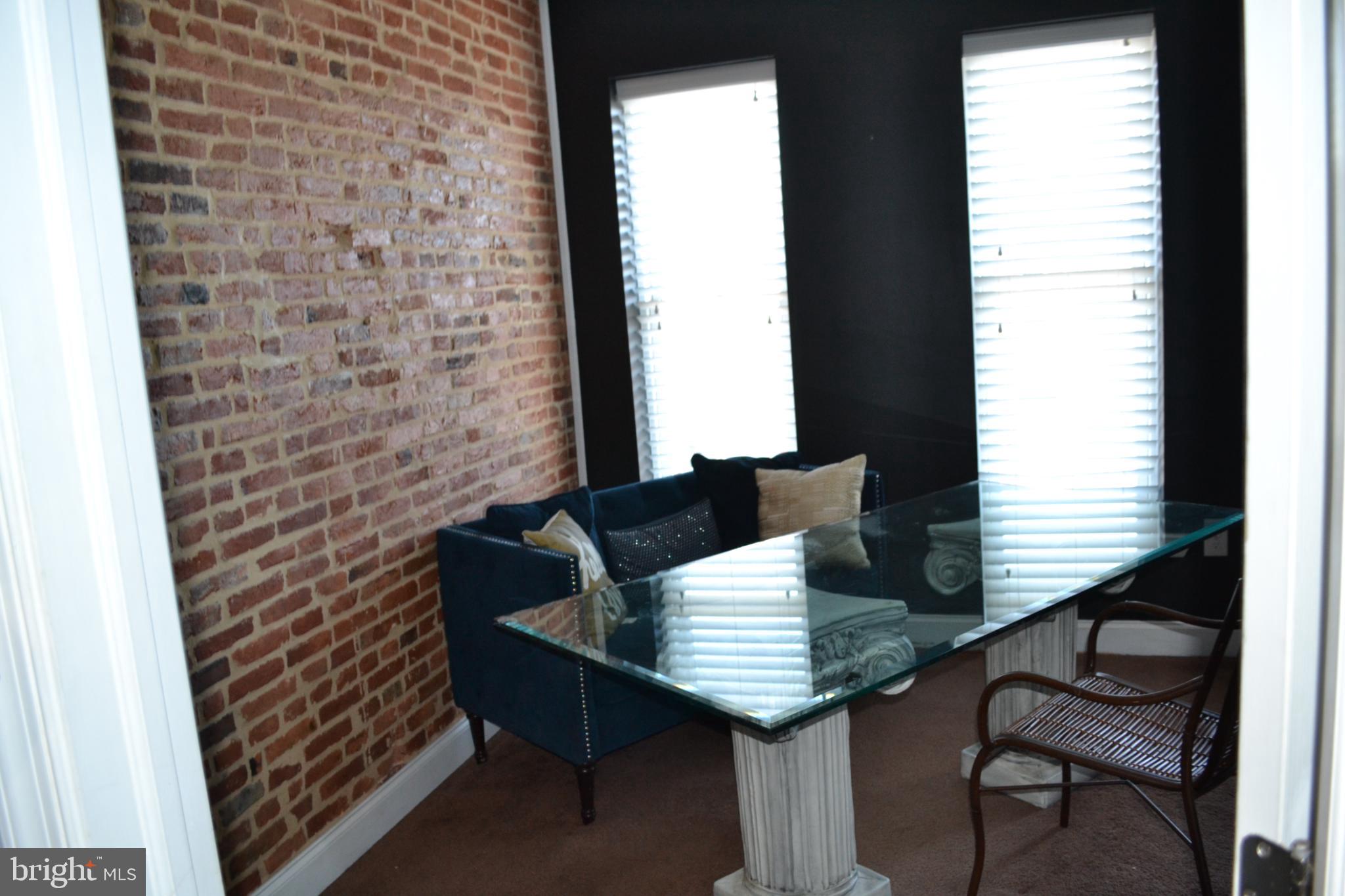 1410 North Bond Street Baltimore, MD 21213 - Photo 11 of 26 a view of a balcony with table and chairs